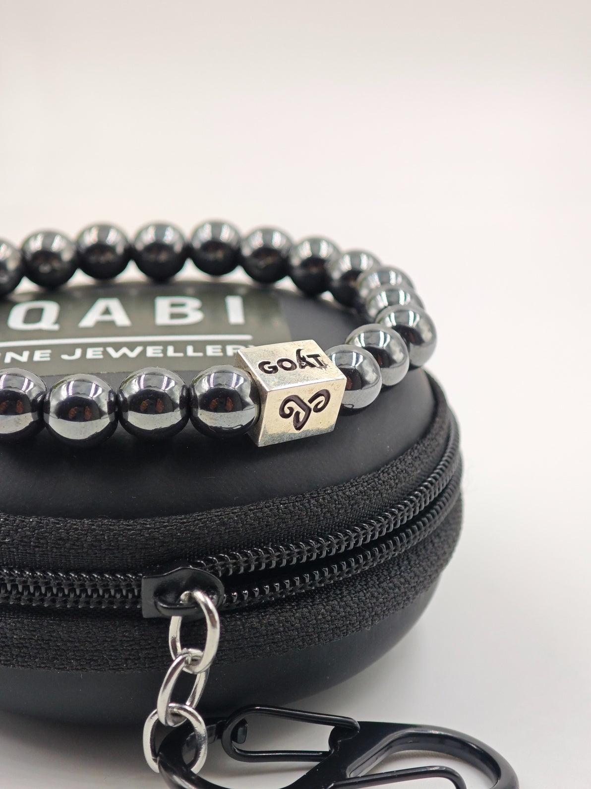 HEMATITE BEADED BAND WITH SILVER G.O.A.T SIGNATURE RECTANGLE DRUM CLASP