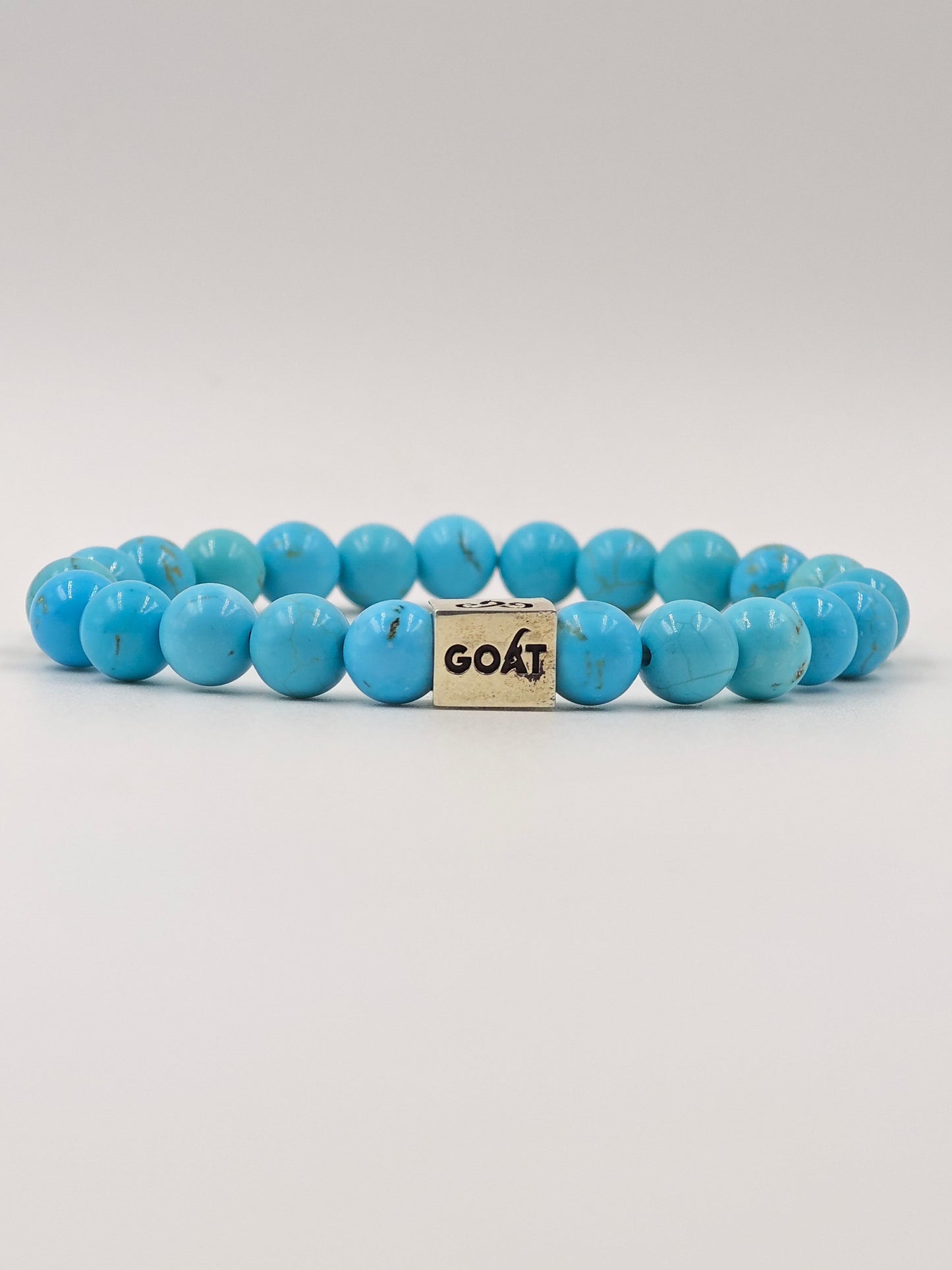 TURQUOISE STONE BEADED BAND WITH SILVER G.O.A.T SIGNATURE RECTANGLE DRUM CLASP