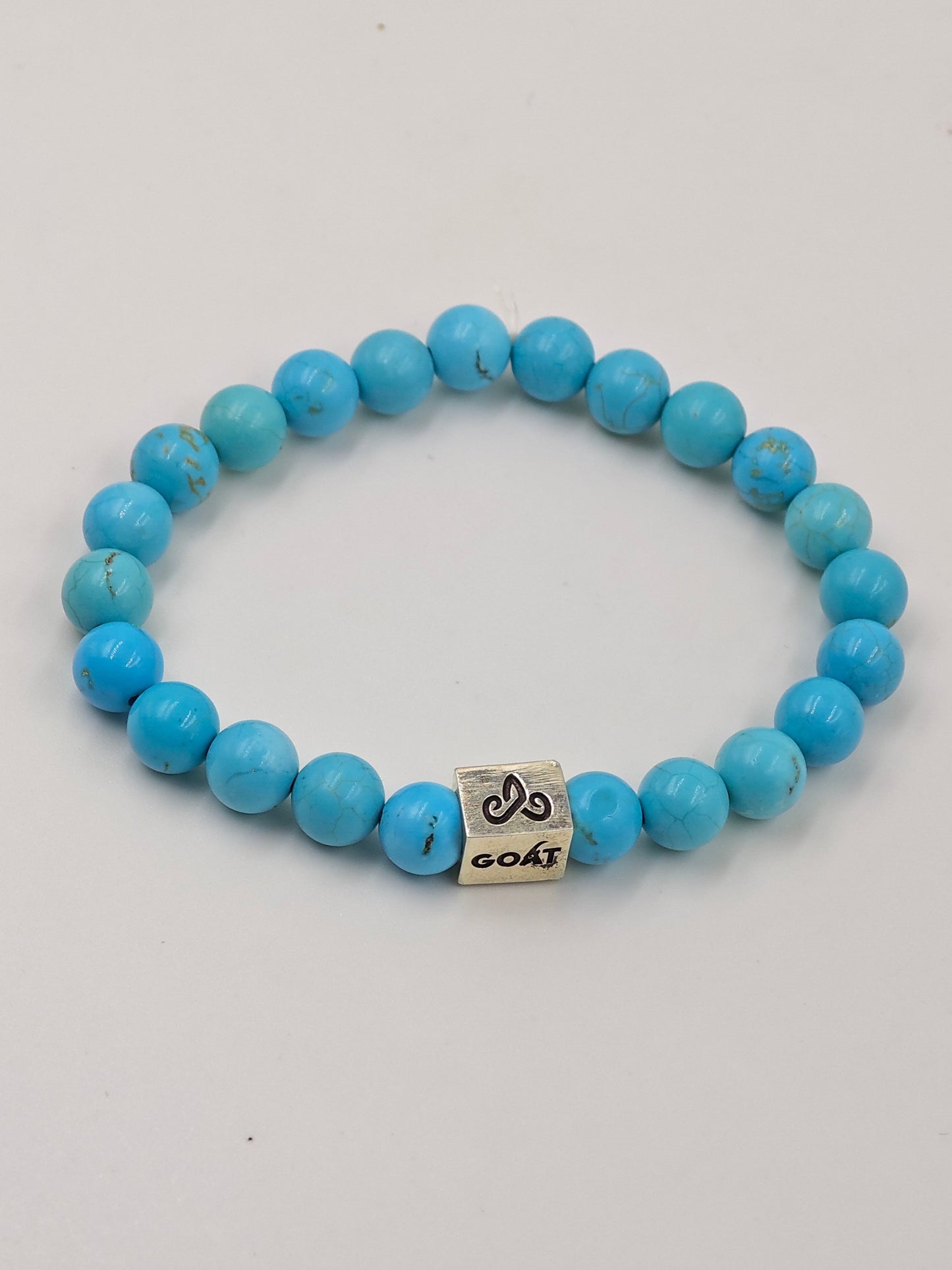 TURQUOISE STONE BEADED BAND WITH SILVER G.O.A.T SIGNATURE RECTANGLE DRUM CLASP