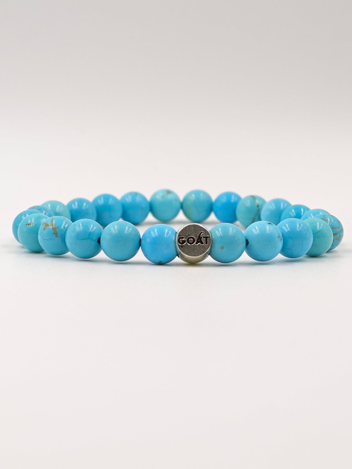 TURQUOISE STONE BEADED BAND WITH SILVER G.O.A.T SIGNATURE ROAUND DRUM CLASP