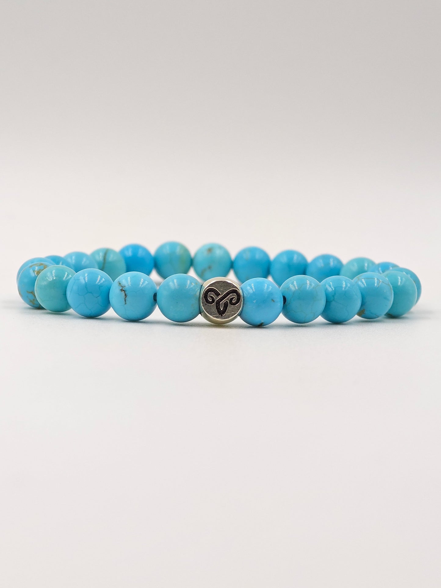 TURQUOISE STONE BEADED BAND WITH SILVER G.O.A.T SIGNATURE ROAUND DRUM CLASP