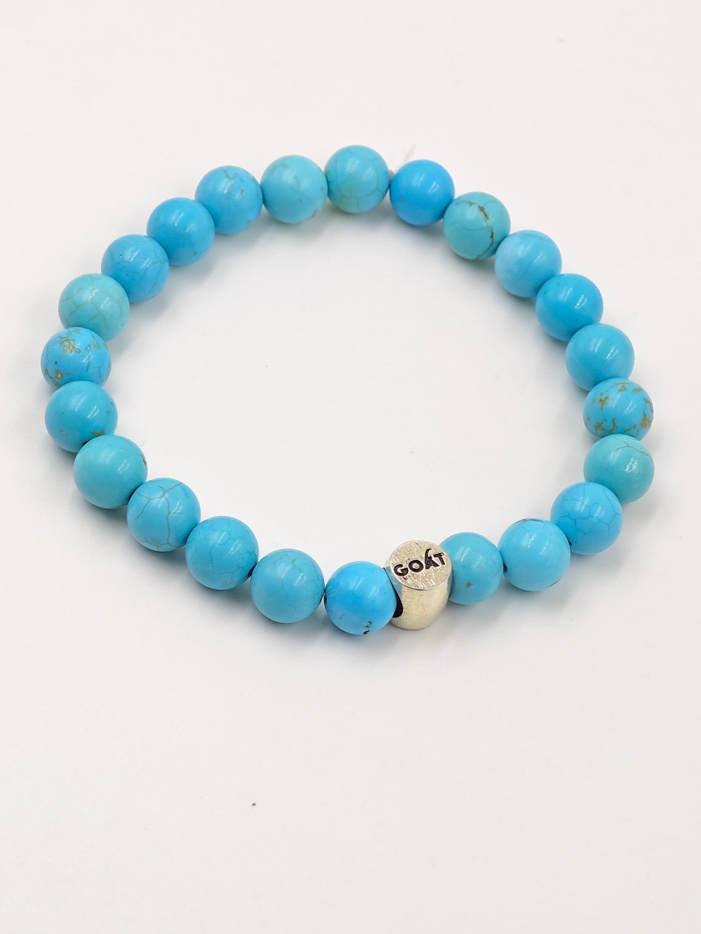 TURQUOISE STONE BEADED BAND WITH SILVER G.O.A.T SIGNATURE ROAUND DRUM CLASP