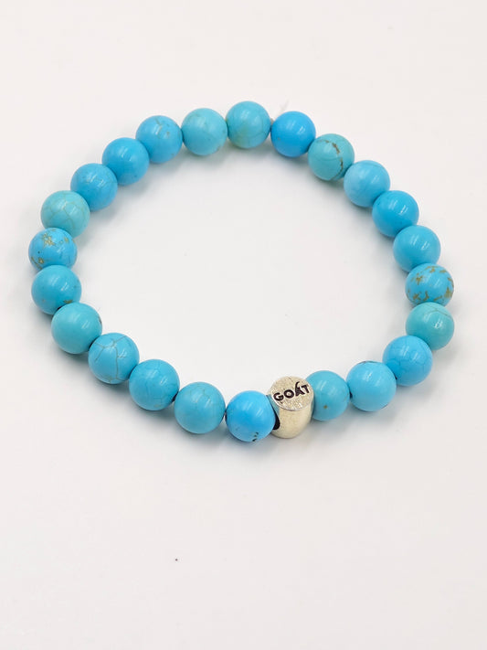 TURQUOISE STONE BEADED BAND WITH SILVER G.O.A.T SIGNATURE ROAUND DRUM CLASP